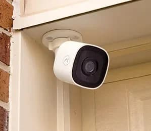 Frontpoint outdoor camera mounted above a doorway