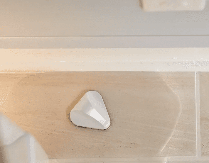 Frontpoint sensor installed on a kitchen counter