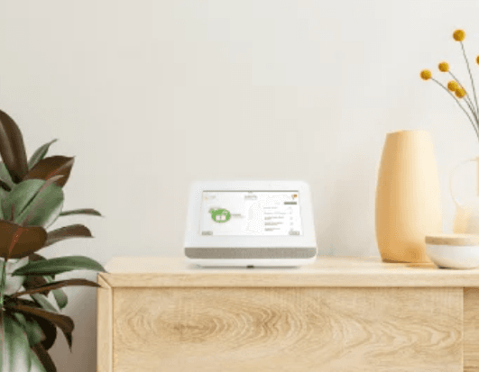 Frontpoint hub on a living room shelf